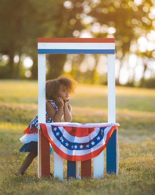 Little girl with a patriotic stand
